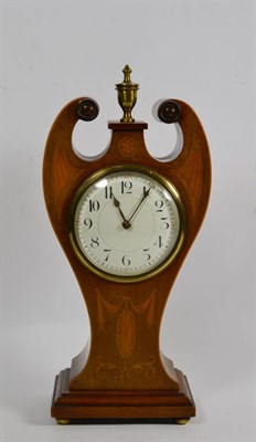 Lot 49 - An Edwardian inlaid mahogany mantel timepiece