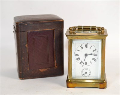 Lot 55 - A brass carriage timepiece with alarm, in fitted travelling case