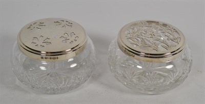 Lot 56 - Two Elizabeth II silver-mounted cut-glass dressing-table jars, the silver mounts by Barker Brothers