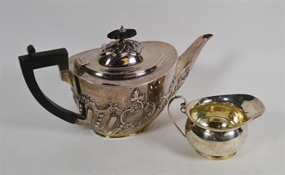 Lot 57 - A Victorian silver teapot, by Charles Stuart Harris, London, 1898, tapering oval, the lower...
