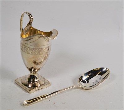 Lot 75 - An 18th century silver marrow spoon, marks indistinct London circa 1770, and a helmet shaped...
