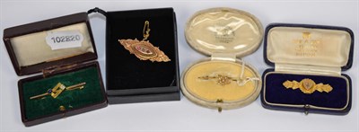 Lot 111 - A 15 carat gold seed pearl bar brooch, length 4cm, a cabochon sapphire and diamond bar brooch,...