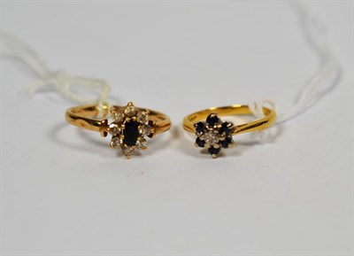 Lot 113 - An 18 carat gold sapphire and diamond cluster ring, finger size J1/2, and a 9 carat gold blue stone