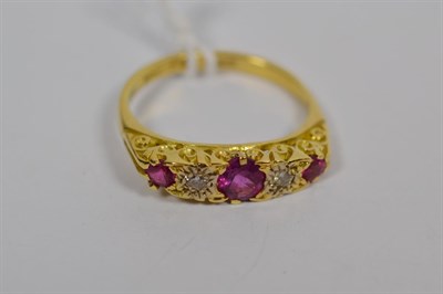 Lot 136 - A ruby and diamond five stone ring, stamped '750', finger size P1/2