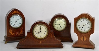 Lot 168 - Four Edwardian mahogany inlaid mantel timepieces (4)