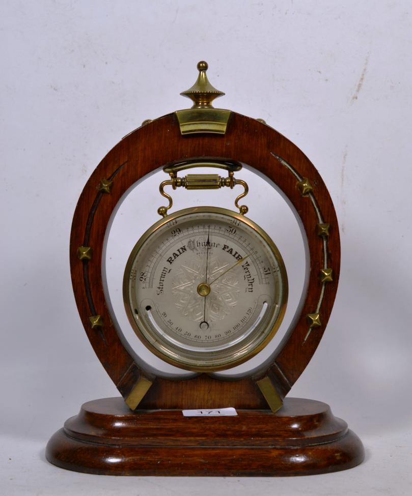 Lot 171 - A Victorian horseshoe form desk aneroid