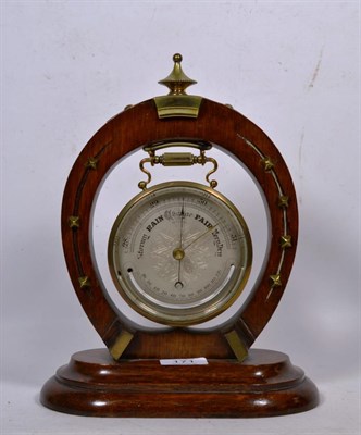 Lot 171 - A Victorian horseshoe form desk aneroid barometer, silvered dial signed Hall & Co., 56 King Street
