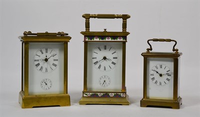 Lot 185 - Two 20th century striking carriage clocks with alarm functions, and a brass carriage timepiece,...