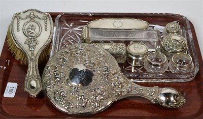 Lot 190 - A collection of silver mounted cut glass dressing table jars, a hairbrush, a hand mirror, and a...