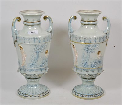 Lot 194 - A pair of continental urn shaped vases, decorated with classical scenes, circa 1900