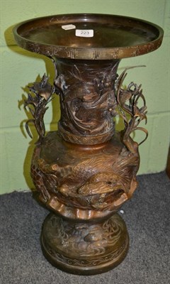 Lot 223 - A Japanese bronze vase, Meiji period, of baluster form cast with birds amongst leafy branches, 56cm