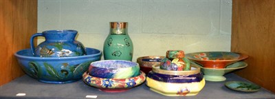 Lot 227 - A collection of decorative ceramics including a Brannam jug and bowl set, stylised with carp on...