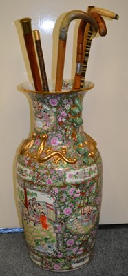 Lot 230 - A reproduction Chinese famille vert vase, 63cm, various sticks including a sectional antler...