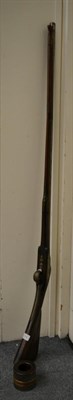 Lot 234 - An 18th century and later musket, together with a shell case