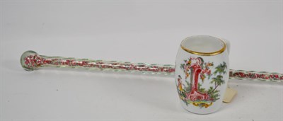 Lot 245 - A Victorian bead filled glass cane, and an 18th century Bohemian milk glass mug