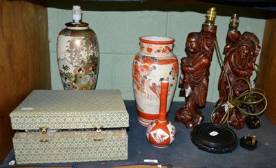 Lot 258 - A Japanese Satsuma lamp, with a Kutani baluster vase and a Kutani bottle vase, by Chinese root wood