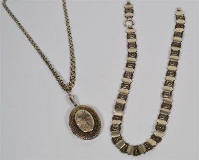 Lot 261 - A Victorian silver locket on chain, locket length 6.2cm, chain length 48cm, together with...