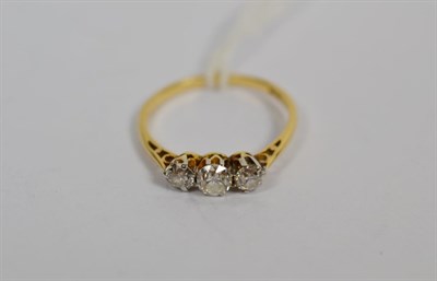 Lot 277 - A diamond three stone ring, stamped '18CT', finger size L1/2