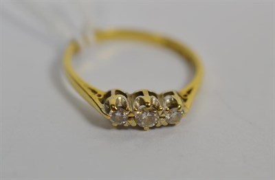 Lot 281 - An 18 carat gold diamond three stone ring, finger size P1/2