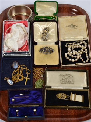 Lot 290 - A hinged silver bangle; another white metal bangle; a cultured pearl necklace; three brooches etc