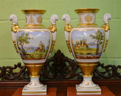 Lot 315 - A pair of 20th century sevres painted and gilt highlighted porcelain twin handled vases, each...