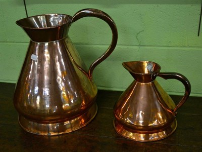 Lot 322 - Two 19th century copper harvest jugs, four gallon and one gallon