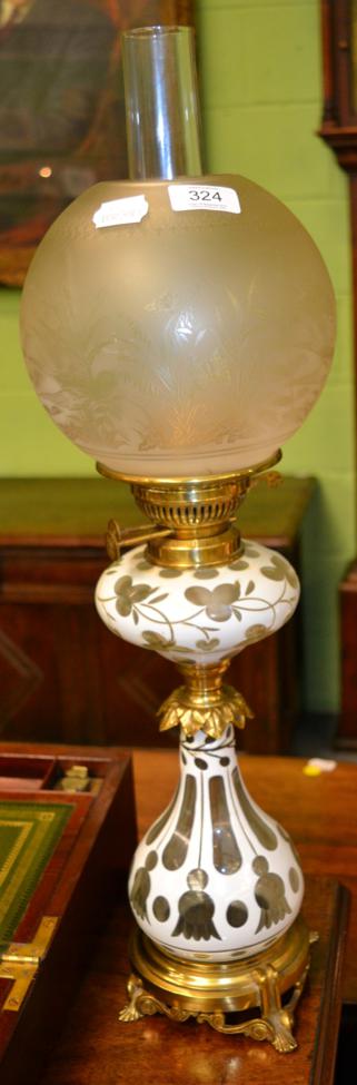 Lot 324 - A Victorian white glass overlay and brass oil lamp