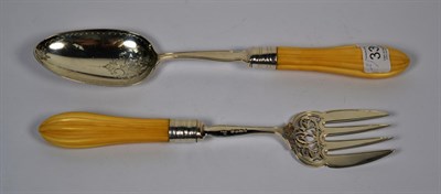 Lot 335 - A pair of Victorian silver-mounted ivory salad-servers, by Thomas Smily, London, 1872, each...