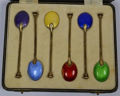 Lot 336 - A cased set of silver and enamel seal top spoons