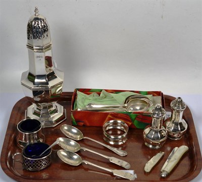 Lot 344 - A silver sugar shaker; together with other silver items including peppers, salt with blue glass...