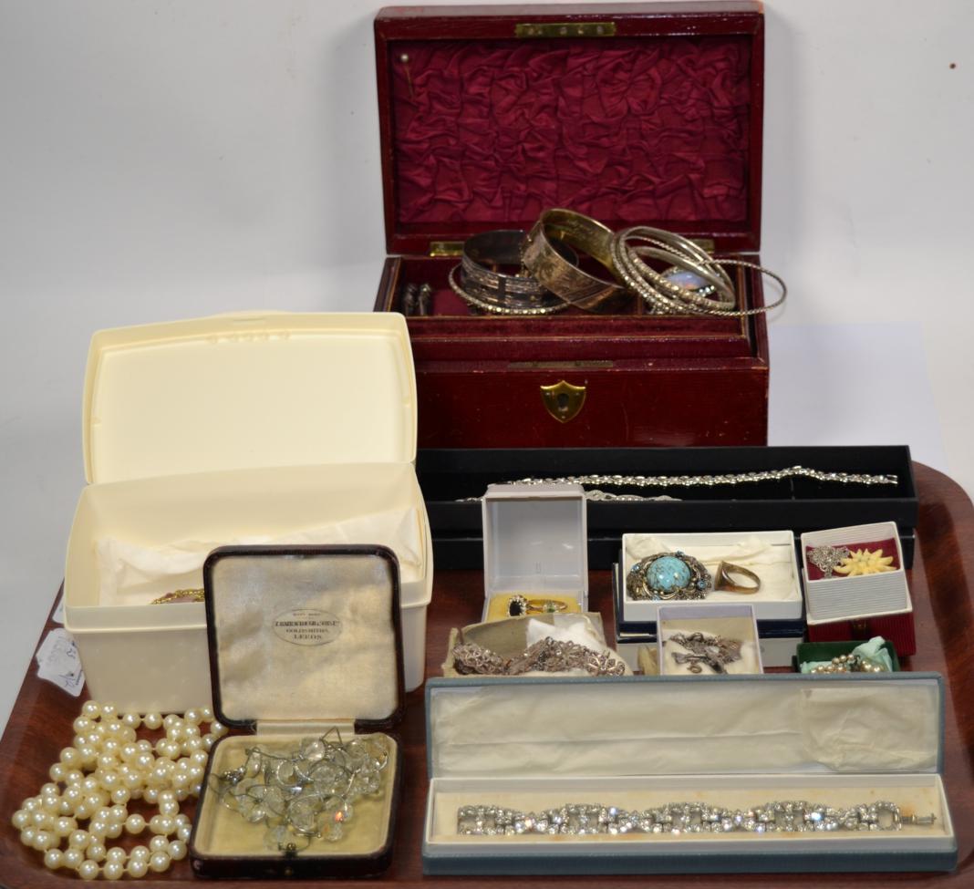 Lot 348 - A quantity of costume jewellery including two gemset rings, bangles,bracelets, brooches,...
