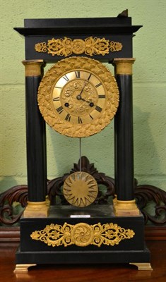 Lot 350 - An ebonised and gilt metal mounted portico striking mantel clock, first part of the 19th century