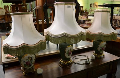 Lot 355 - Three similar floral painted table lamps, with silk shades (3)