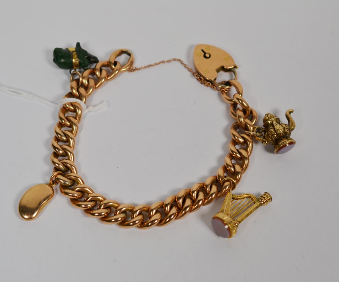 Lot 364 - A charm bracelet, each link stamped '9C', hung with four charms comprising of a pig, a coffee bean
