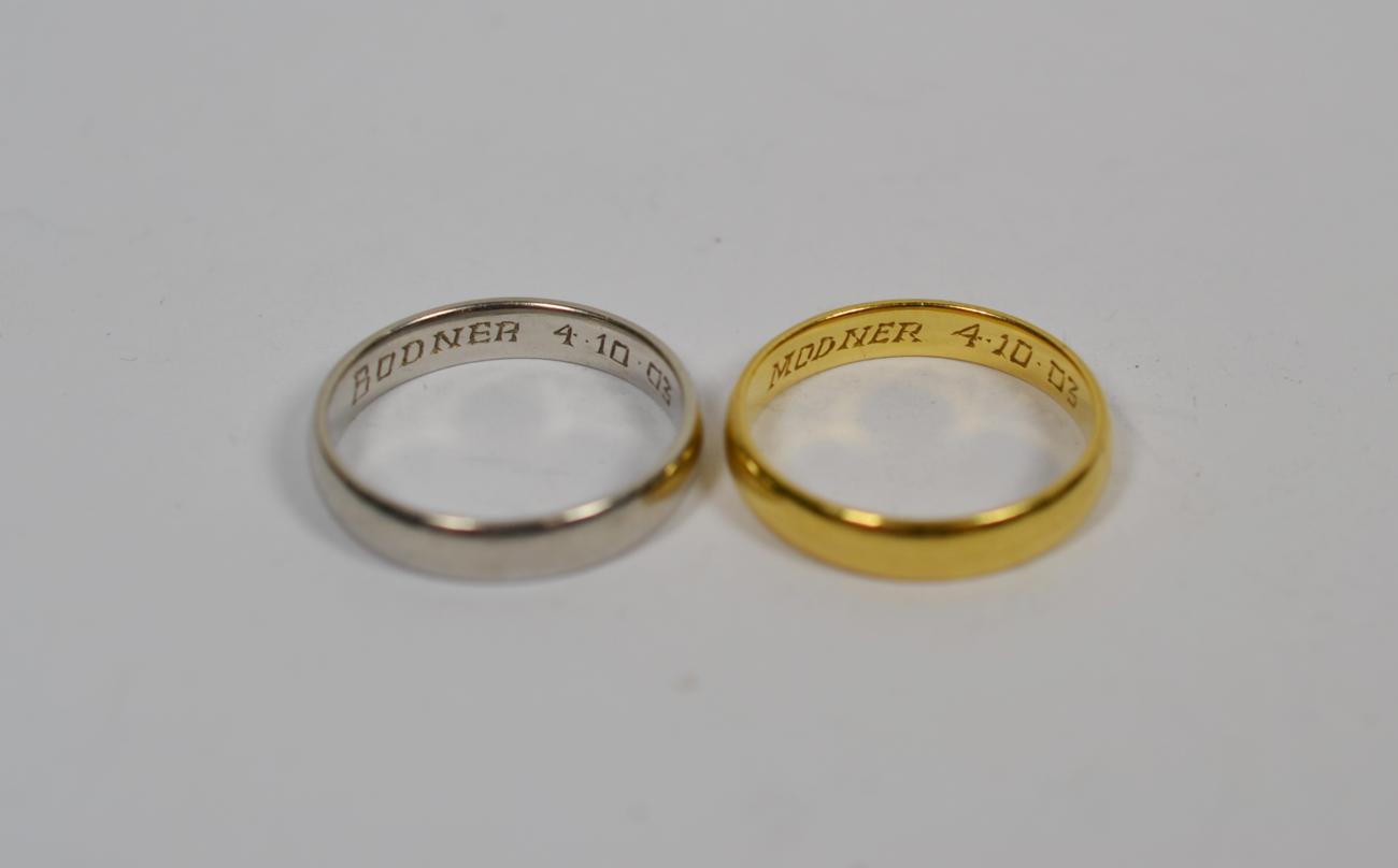 Lot 367 - An 18 carat gold band ring, finger size Q, and a platinum band ring P1/2