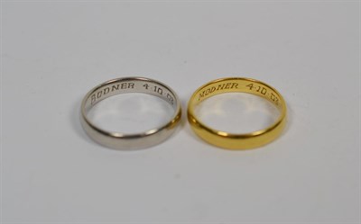 Lot 367 - An 18 carat gold band ring, finger size Q, and a platinum band ring P1/2