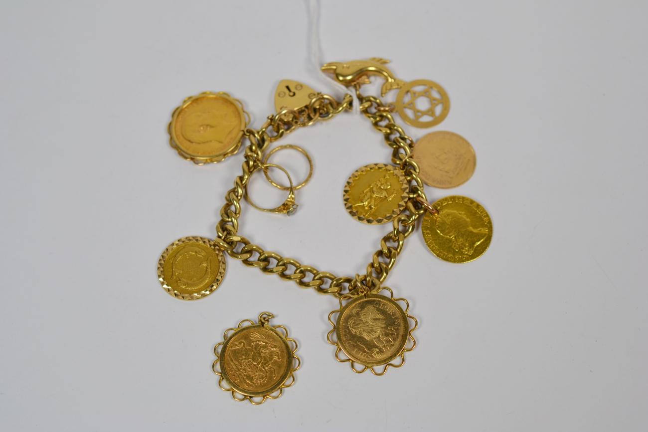 Lot 369 - A charm bracelet, each link stamped '9' '.375', hung with ten charms (one detached) including...