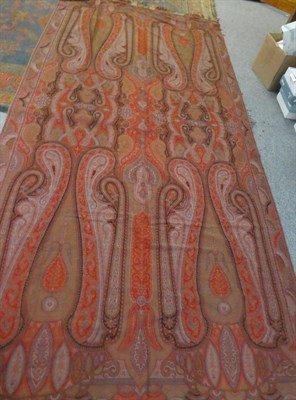 Lot 1015 - 19th century Paisley red ground woven throw, cream wool shawl with blue woven trim, cream wool...