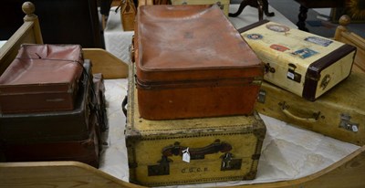 Lot 1053 - Seven assorted vintage suitcases, including two pigskin cases (7)