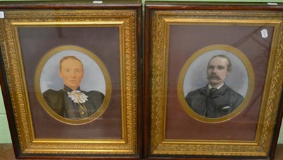 Lot 1081 - A pair of early 20th century overpainted portrait photographs, lady and gentleman, in good gilt and
