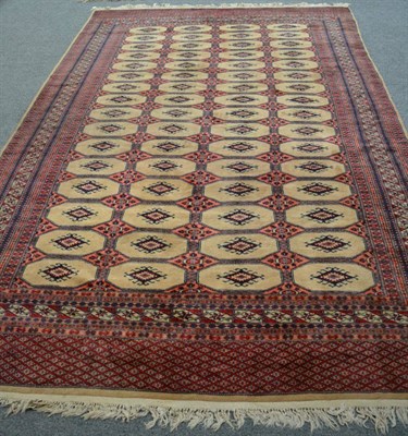 Lot 1151 - Lahore Bukhara carpet, the field with columns of octagons enclosed multiple borders, 296cm by 193cm