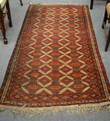 Lot 1152 - Bukhara rug, the field with columns of hexagons enclosed by narrow borders, 197cm by 108cm