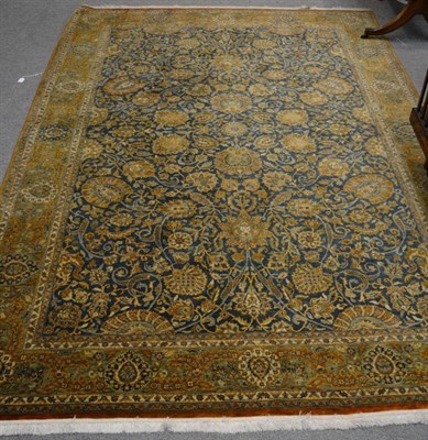 Lot 1154 - A finely woven modern Oriental carpet, probably Lahore, the indigo field with an all over design of