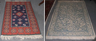 Lot 1157 - Anatolian Kilim, the indigo field of hook guls enclosed by geometric motif borders, 153cm by...