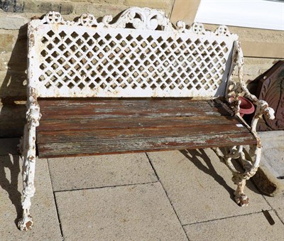 Lot 1171 - A late Victorian Coalbrookdale style white painted cast iron bench with dog form arms