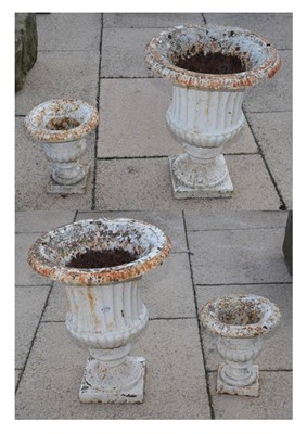 Lot 1179 - Two pairs of Victorian white painted cast iron part gadrooned garden urns