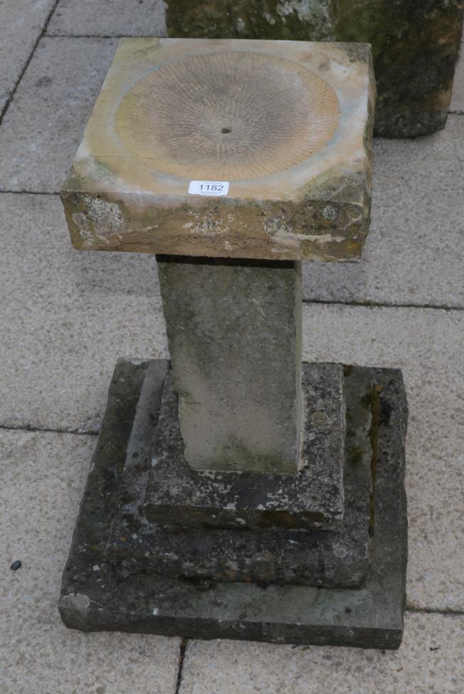 Lot 1182 - A weathered stone sundial pillar (metal sundial lacking) on a stepped square base