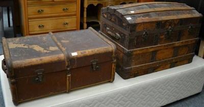 Lot 1214 - A metal bound dome topped trunk, together with a wooden bound canvas travelling trunk (2)