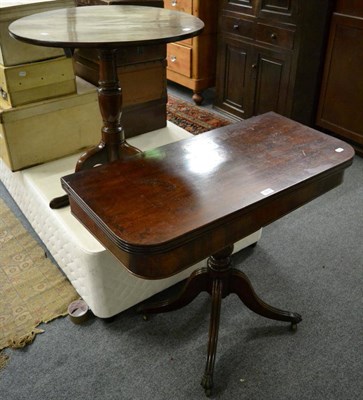 Lot 1217 - A 19th century mahogany fold over tea table, together with a 19th century tilt top tripod table (2)