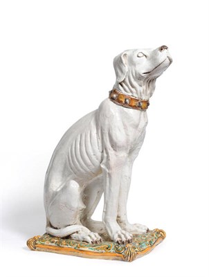 Lot 81 - An Italian Maiolica Figure of a Seated Hound, 19th century, in the white with brown studded collar